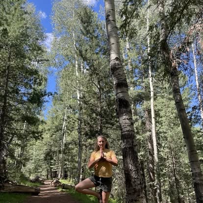 Jennifer Snider practicing tree pose in soft natural light